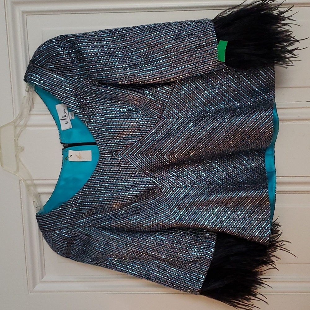 Mira Couture $990 sparkling top with feathers